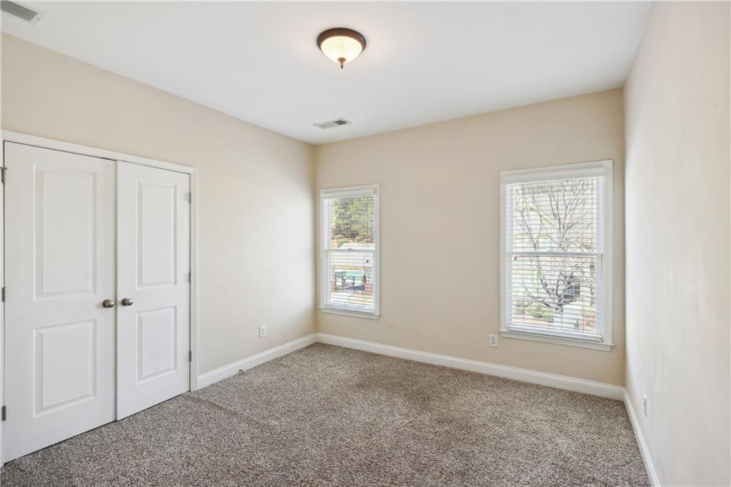 337 Myrtle Trace Lane Suwanee, GA 30024 - Photo 11 of 14 a view of an empty room with a window