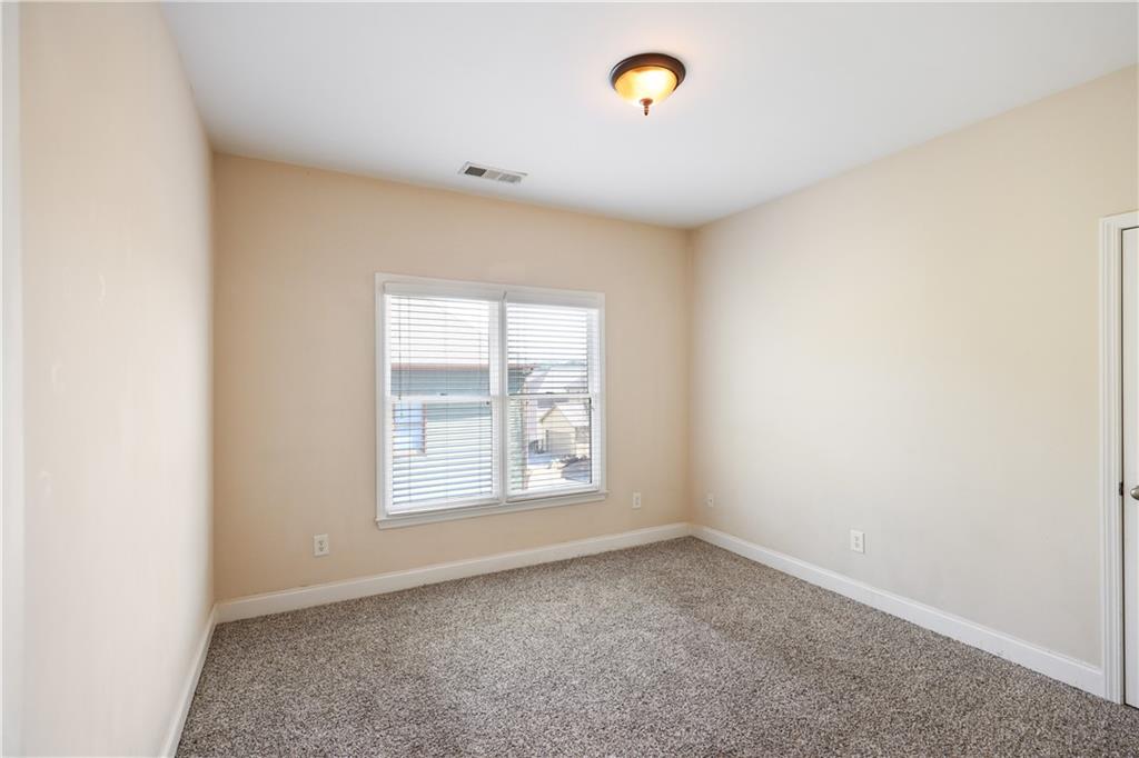 337 Myrtle Trace Lane Suwanee, GA 30024 - Photo 12 of 14 an empty room with a window