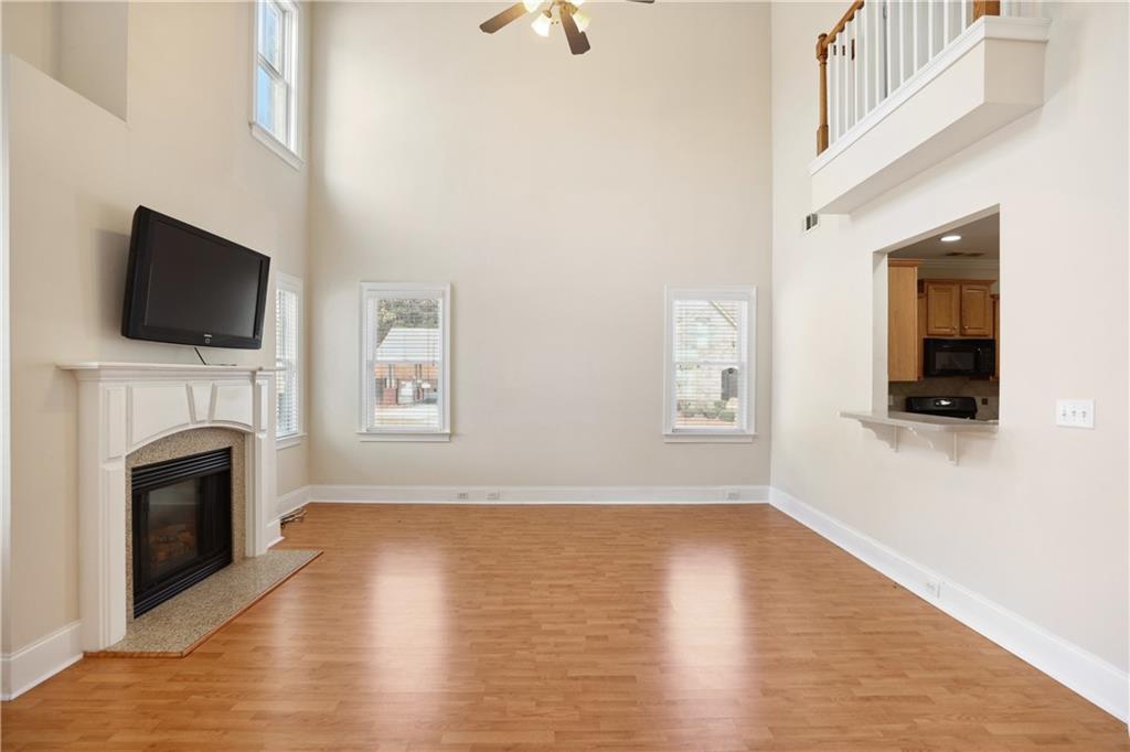 337 Myrtle Trace Lane Suwanee, GA 30024 - Photo 4 of 14 a view of livingroom with furniture wooden floor and fireplace