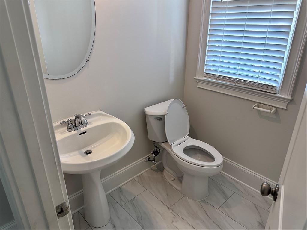 337 Myrtle Trace Lane Suwanee, GA 30024 - Photo 10 of 14 a bathroom with a sink toilet and a mirror