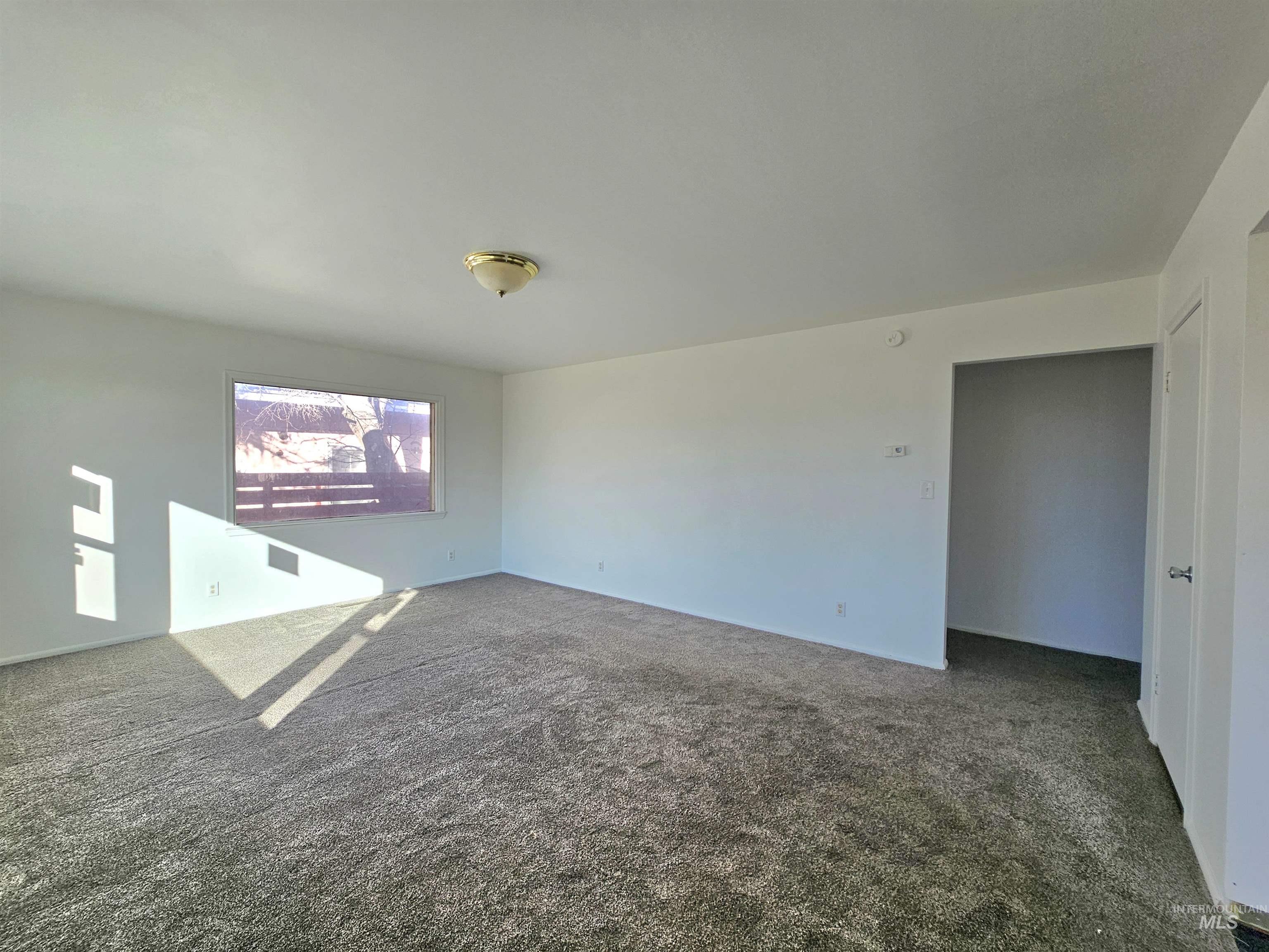 810 South D Street Rupert, ID 83350 - Photo 19 of 23 Spare room with dark colored carpet