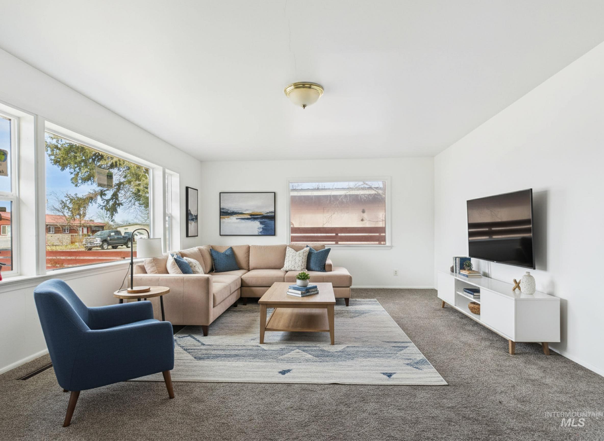 810 South D Street Rupert, ID 83350 - Photo 2 of 23 Living area with dark carpet and baseboards