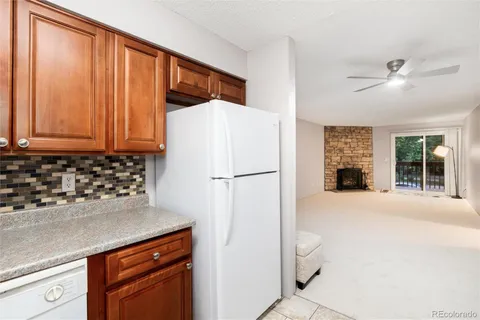 a kitchen with a refrigerator and a sink