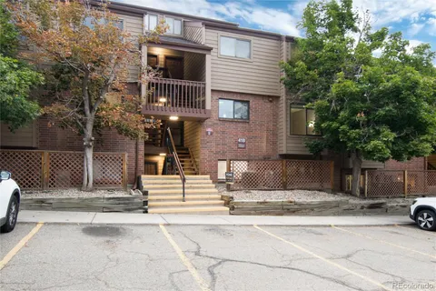 a view of a brick house with many windows