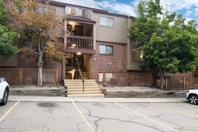 a view of a brick house with many windows