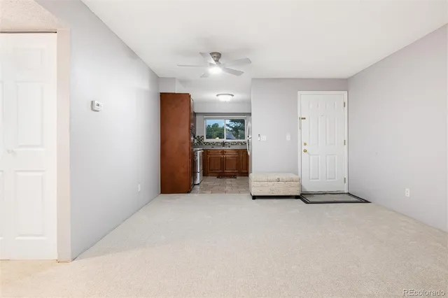 a view of an empty room with a window