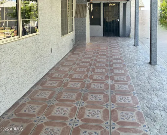 a view of a brick house with a glass door