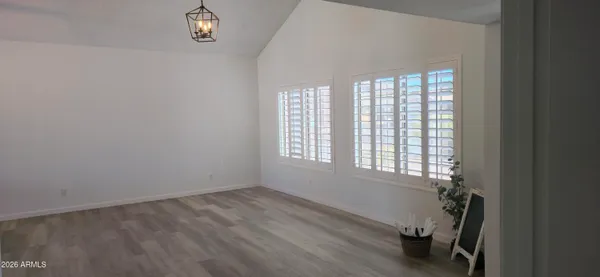 wooden floor and window in an empty room
