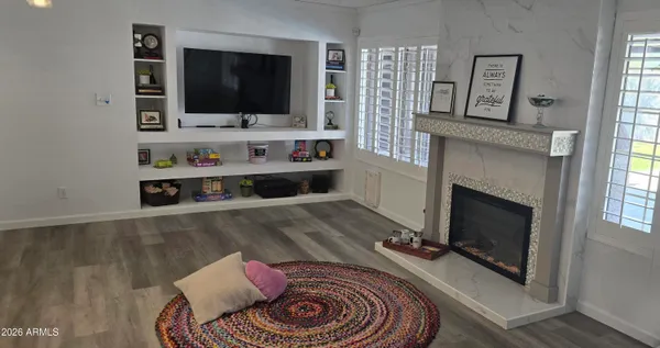 a living room with furniture and a flat screen tv