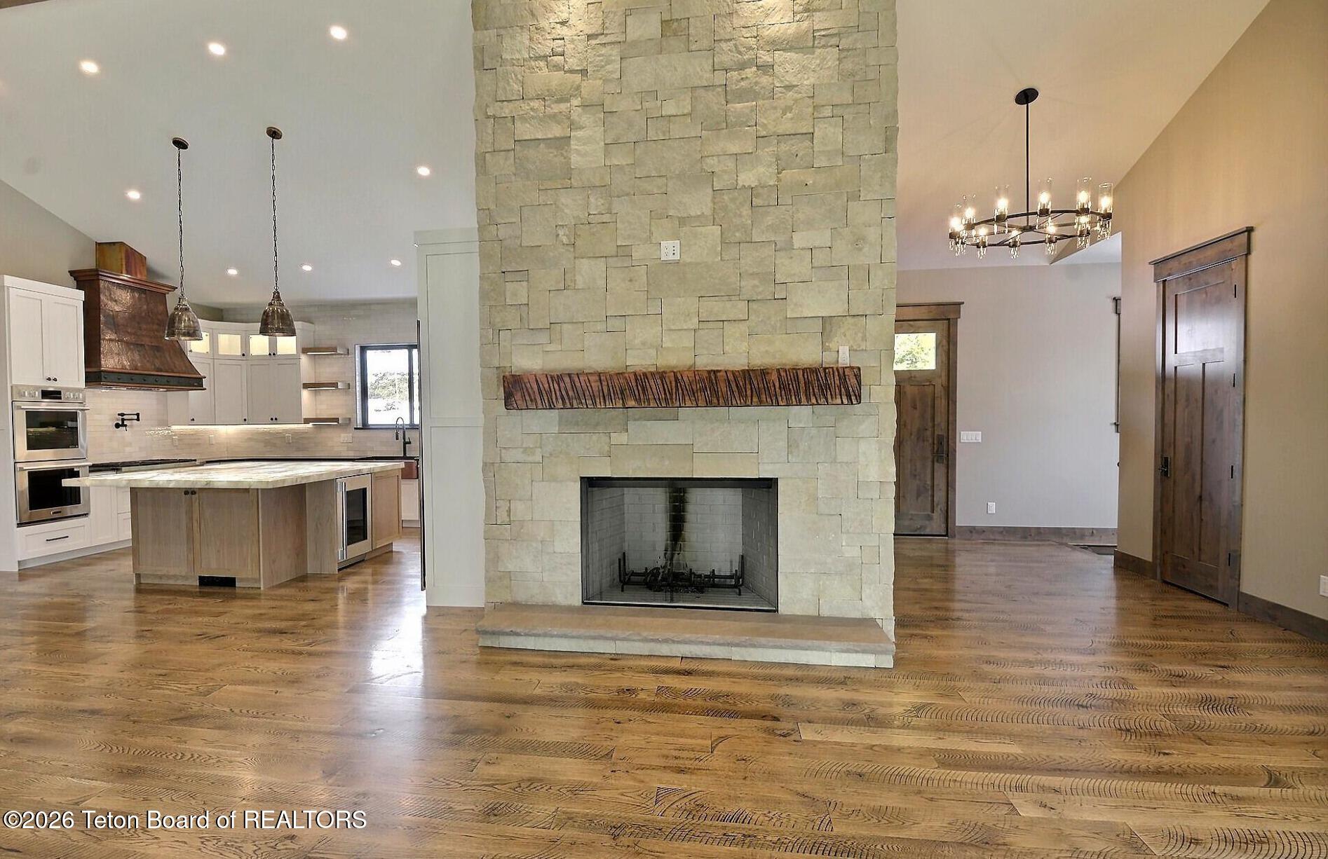 5727 Forest Ridge Road Victor, ID 83455 - Photo 52 of 76 Great Room Wood Fireplace