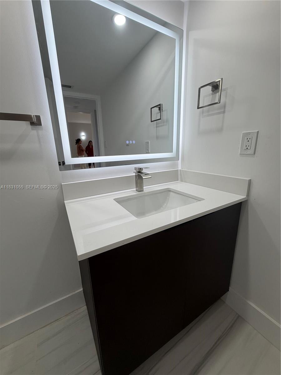16251 Golf Club Road, Unit 204 Weston, FL 33326 - Photo 14 of 40 a close up of a sink and a mirror
