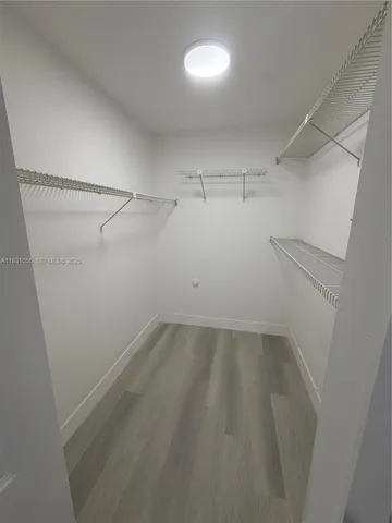 a view of storage and utility room with washer and dryer