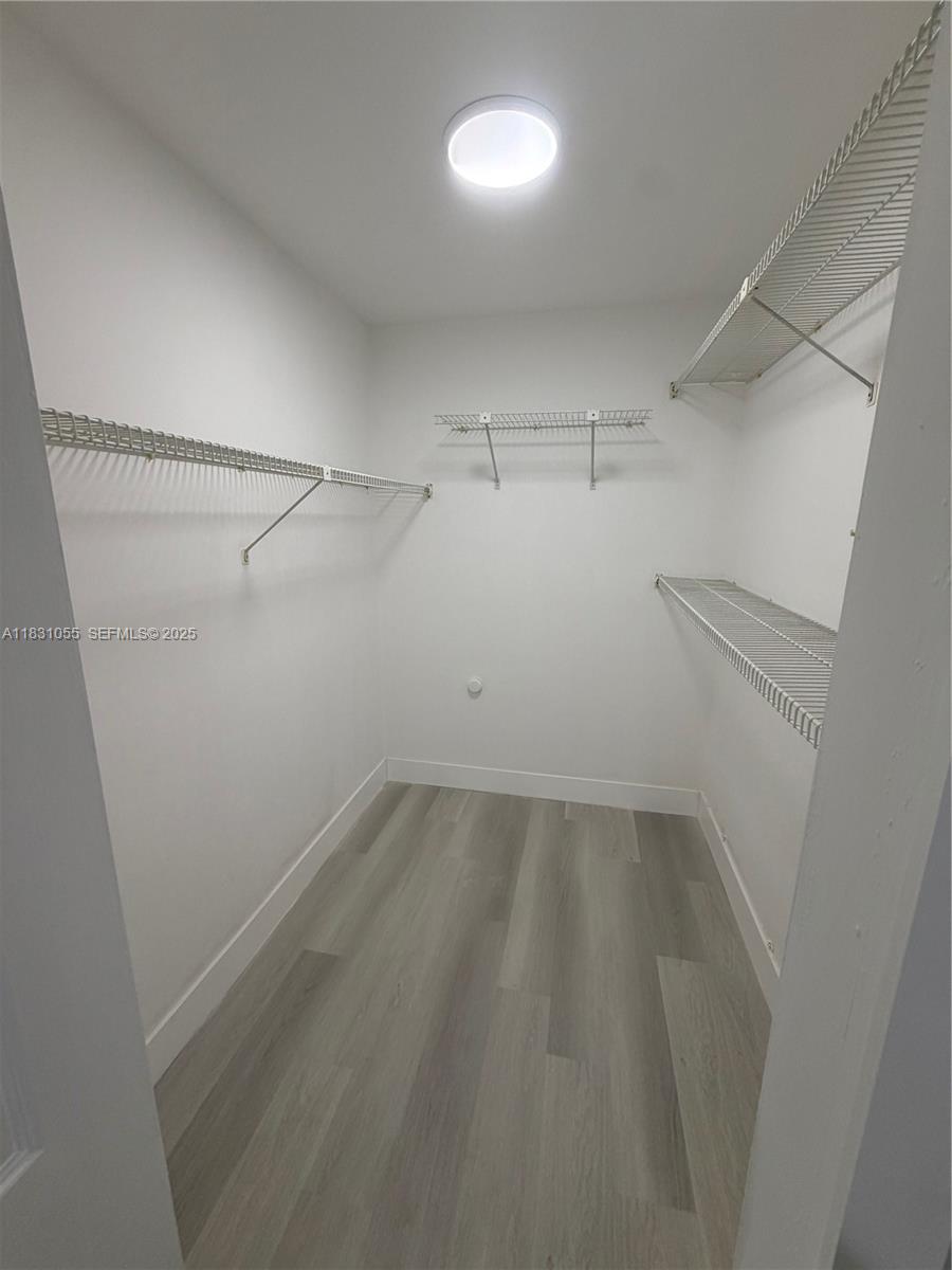 16251 Golf Club Road, Unit 204 Weston, FL 33326 - Photo 15 of 40 a view of a room with racks on the wall