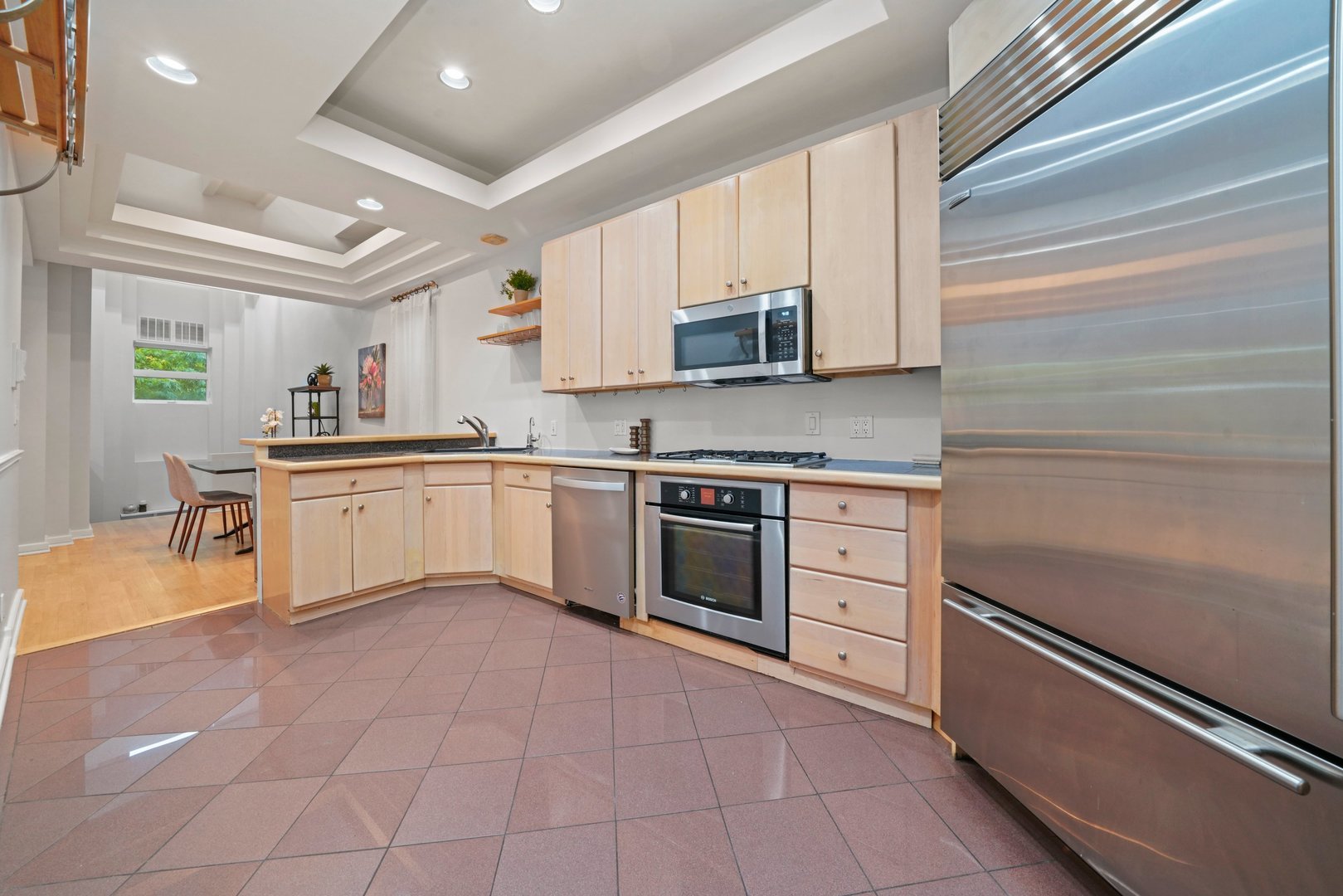 1407 North Mohawk Street, Unit 3 Chicago, IL 60610 - Photo 7 of 19 a kitchen with stainless steel appliances granite countertop a sink and cabinets