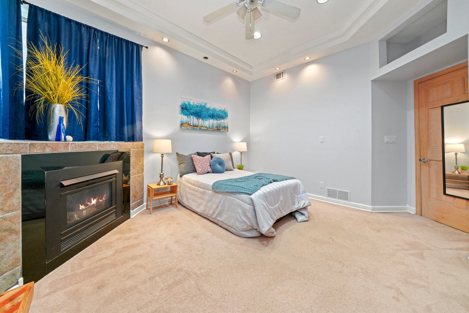 1407 North Mohawk Street, Unit 3 Chicago, IL 60610 - Photo 9 of 19 a bedroom with a bed and a fireplace