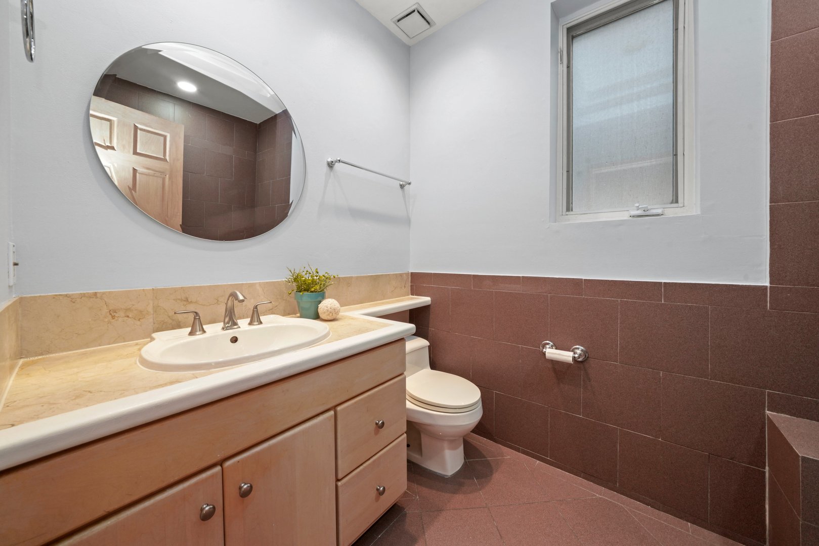 1407 North Mohawk Street, Unit 3 Chicago, IL 60610 - Photo 10 of 19 a bathroom with a toilet sink and mirror