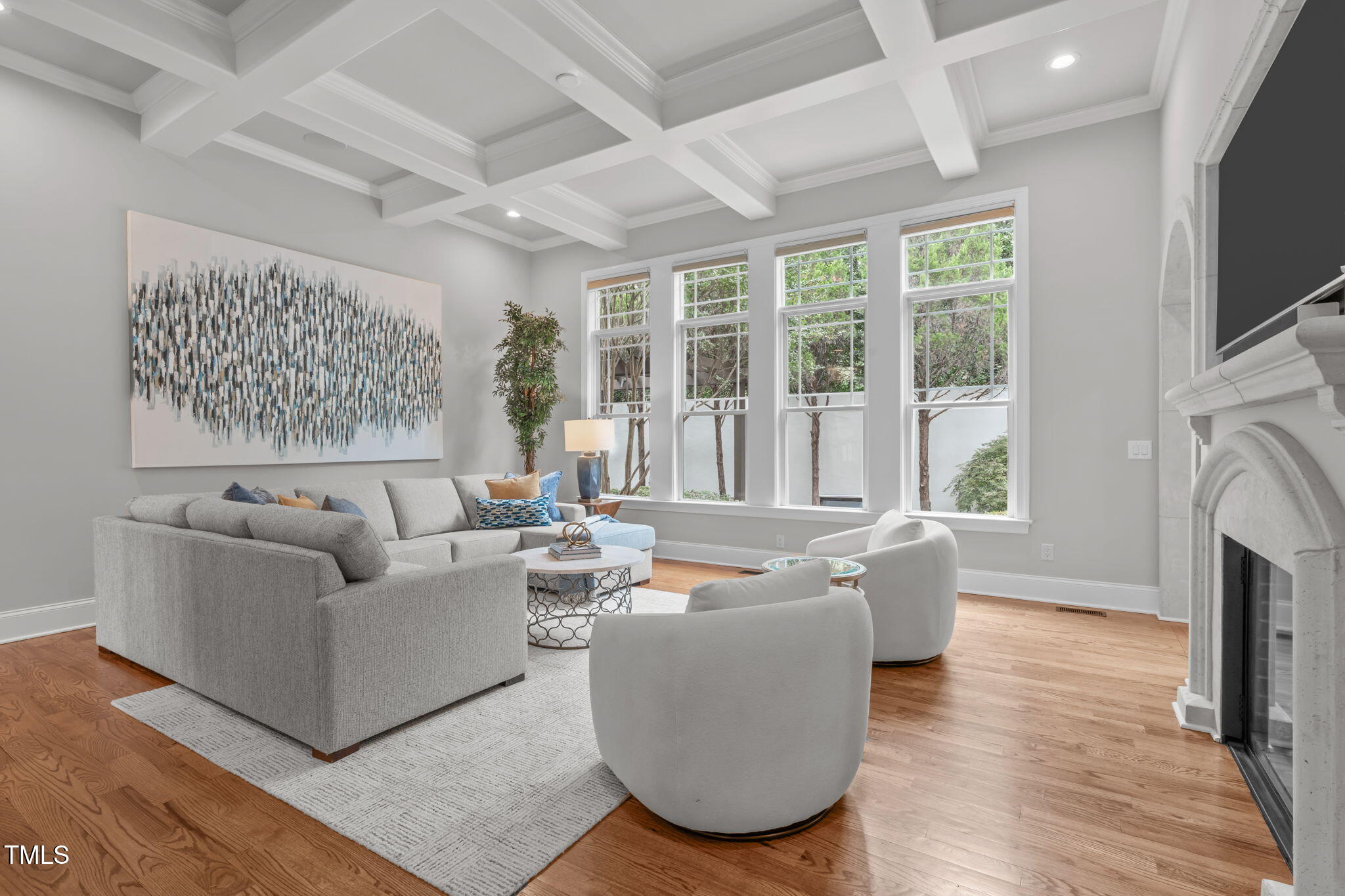 2612 Shadow Hills Court Raleigh, NC 27612 - Photo 11 of 63 a living room with fireplace furniture and a flat screen tv