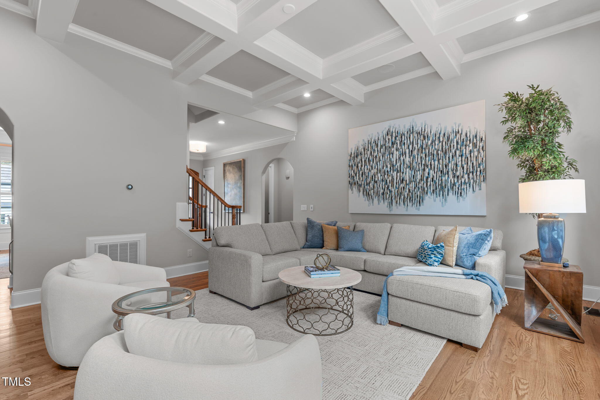 2612 Shadow Hills Court Raleigh, NC 27612 - Photo 12 of 63 a living room with furniture and a wooden floor