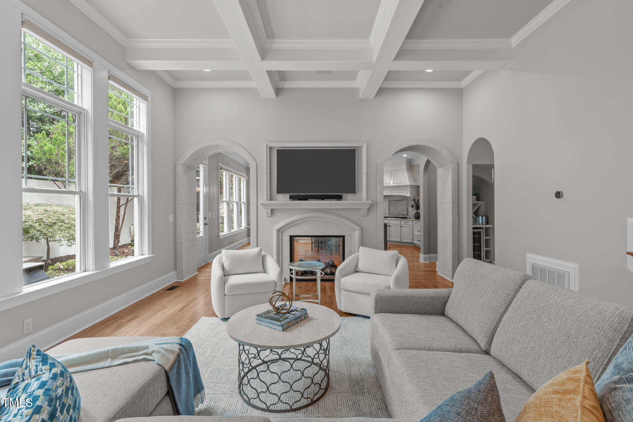 2612 Shadow Hills Court Raleigh, NC 27612 - Photo 14 of 63 a living room with furniture a fireplace and a flat screen tv