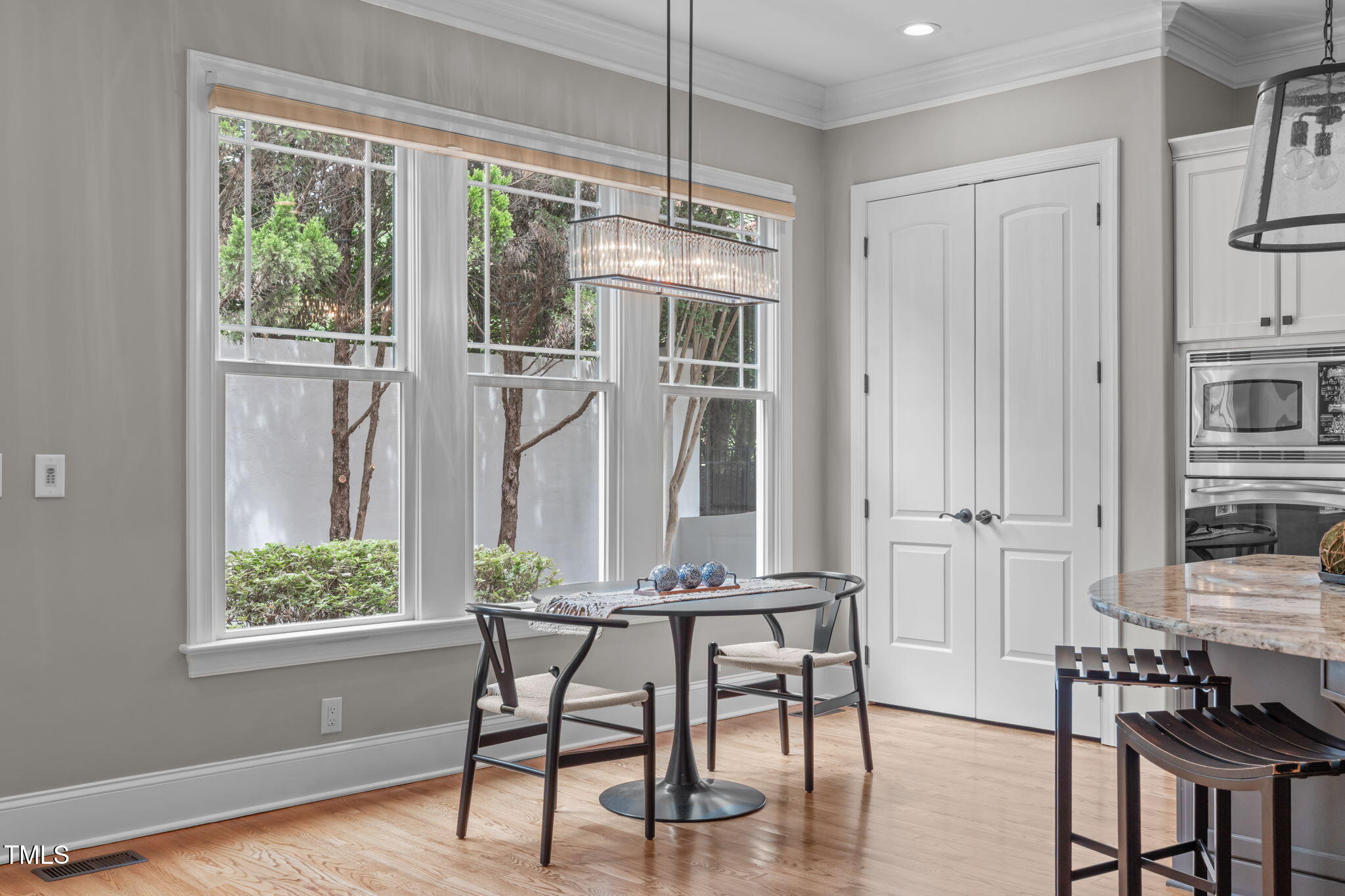 2612 Shadow Hills Court Raleigh, NC 27612 - Photo 21 of 63 a view of a dining room with furniture window and wooden floor
