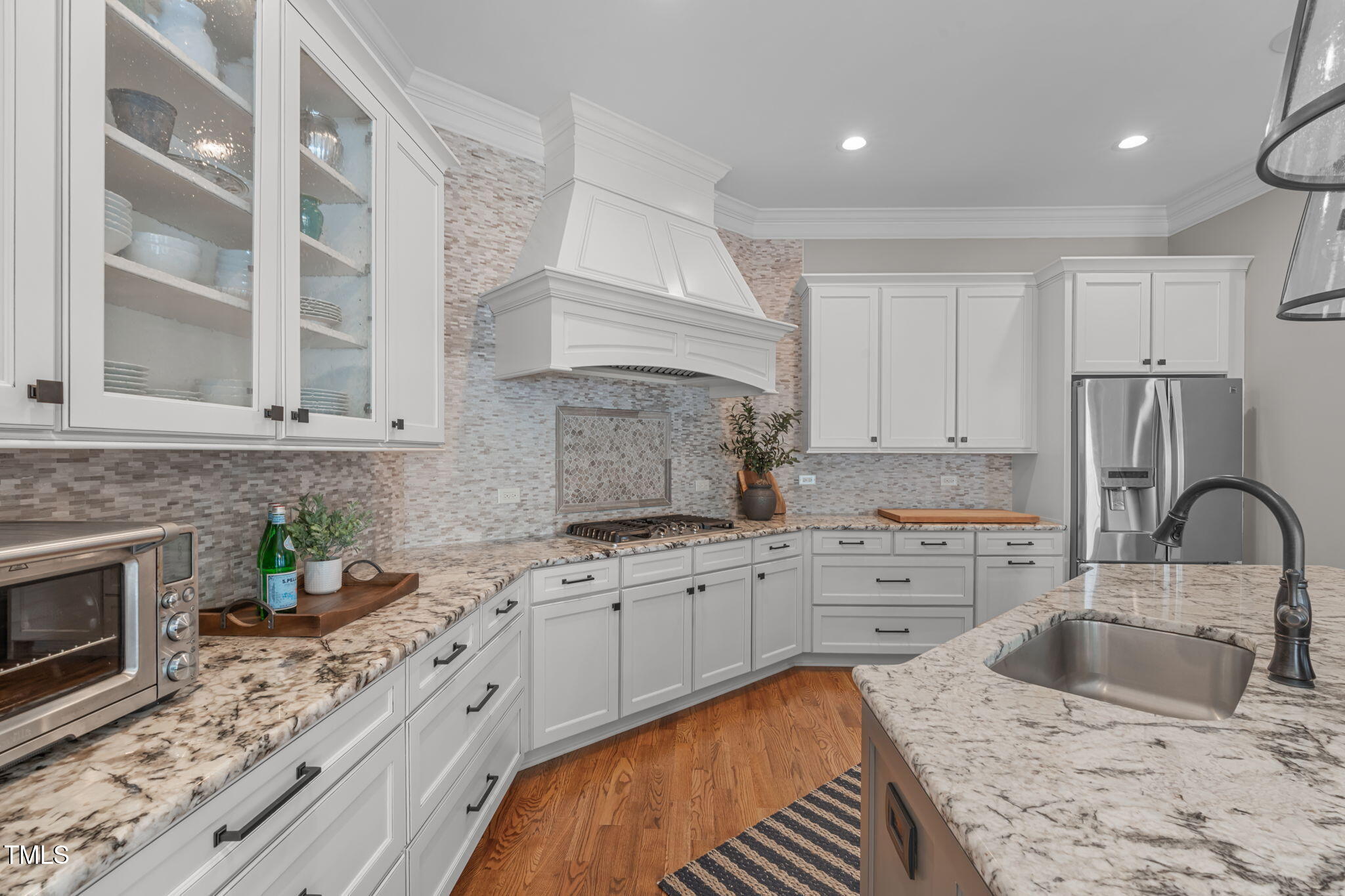 2612 Shadow Hills Court Raleigh, NC 27612 - Photo 24 of 63 a kitchen with stainless steel appliances granite countertop a sink stove and cabinets