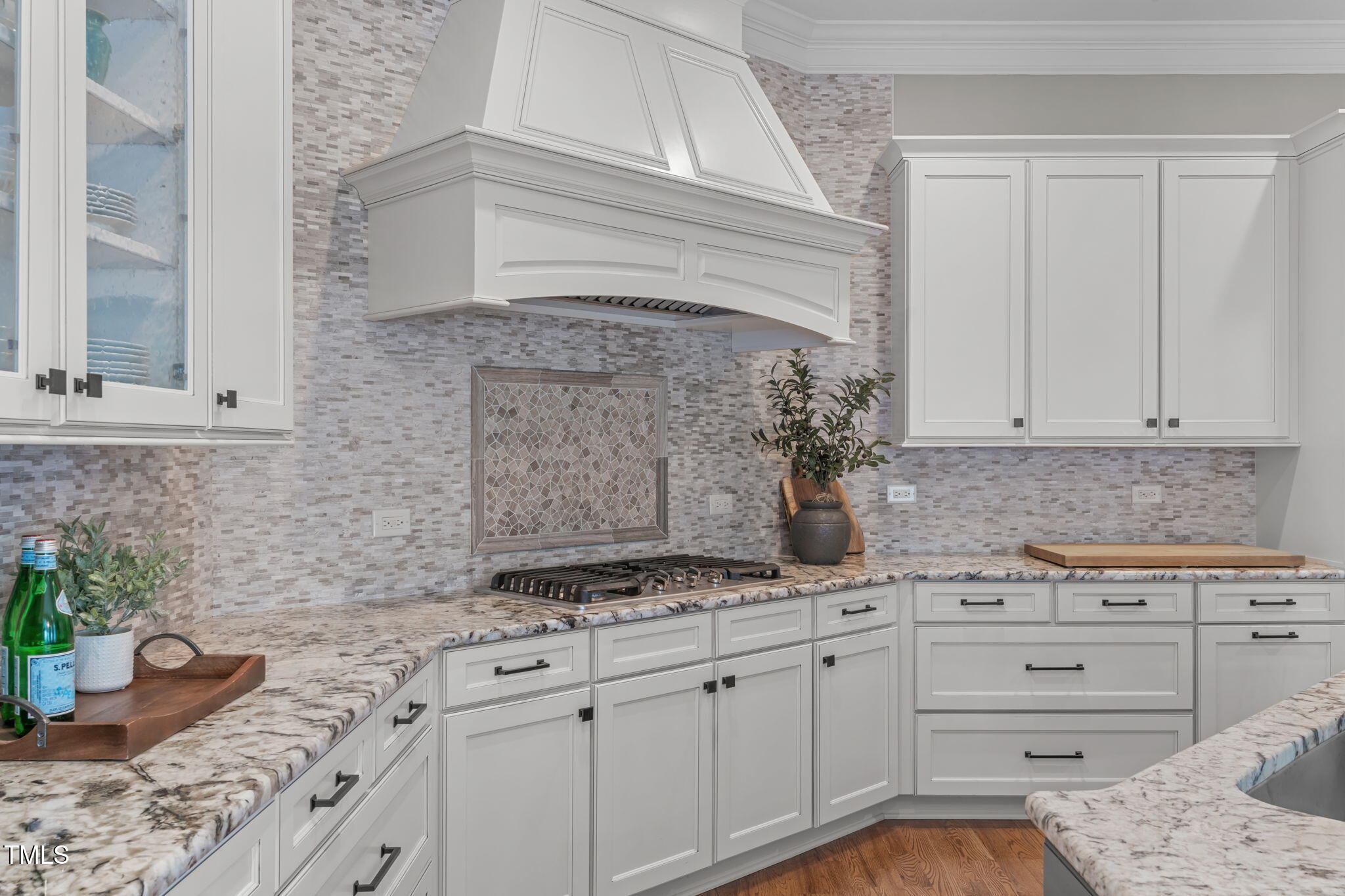 2612 Shadow Hills Court Raleigh, NC 27612 - Photo 25 of 63 a kitchen with granite countertop a sink and cabinets