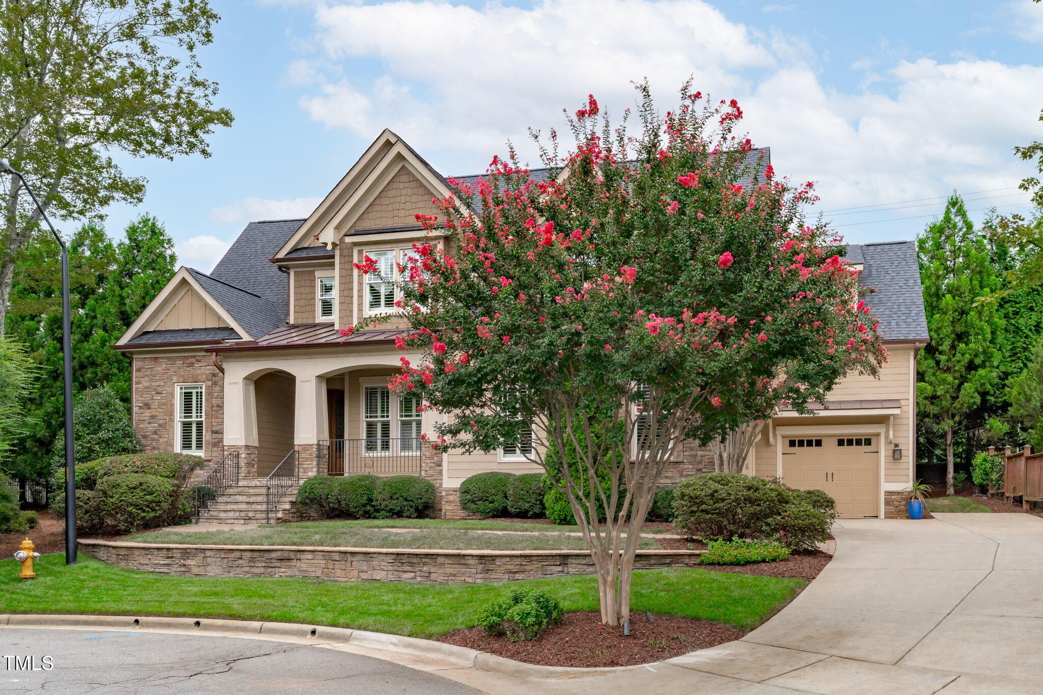 2612 Shadow Hills Court Raleigh, NC 27612 - Photo 2 of 63 a front view of a house with a garden and trees