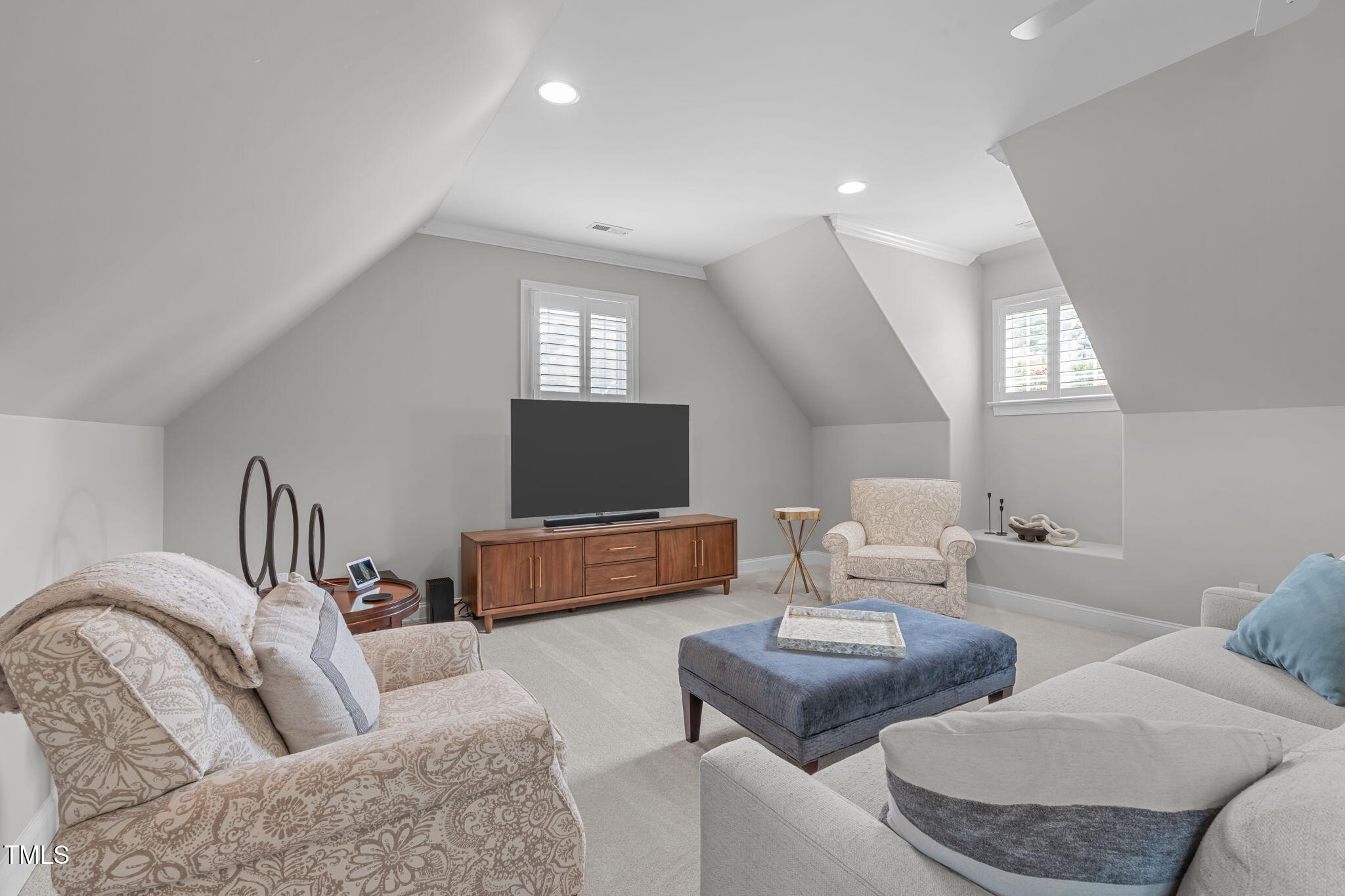 2612 Shadow Hills Court Raleigh, NC 27612 - Photo 39 of 63 a living room with furniture and a flat screen tv