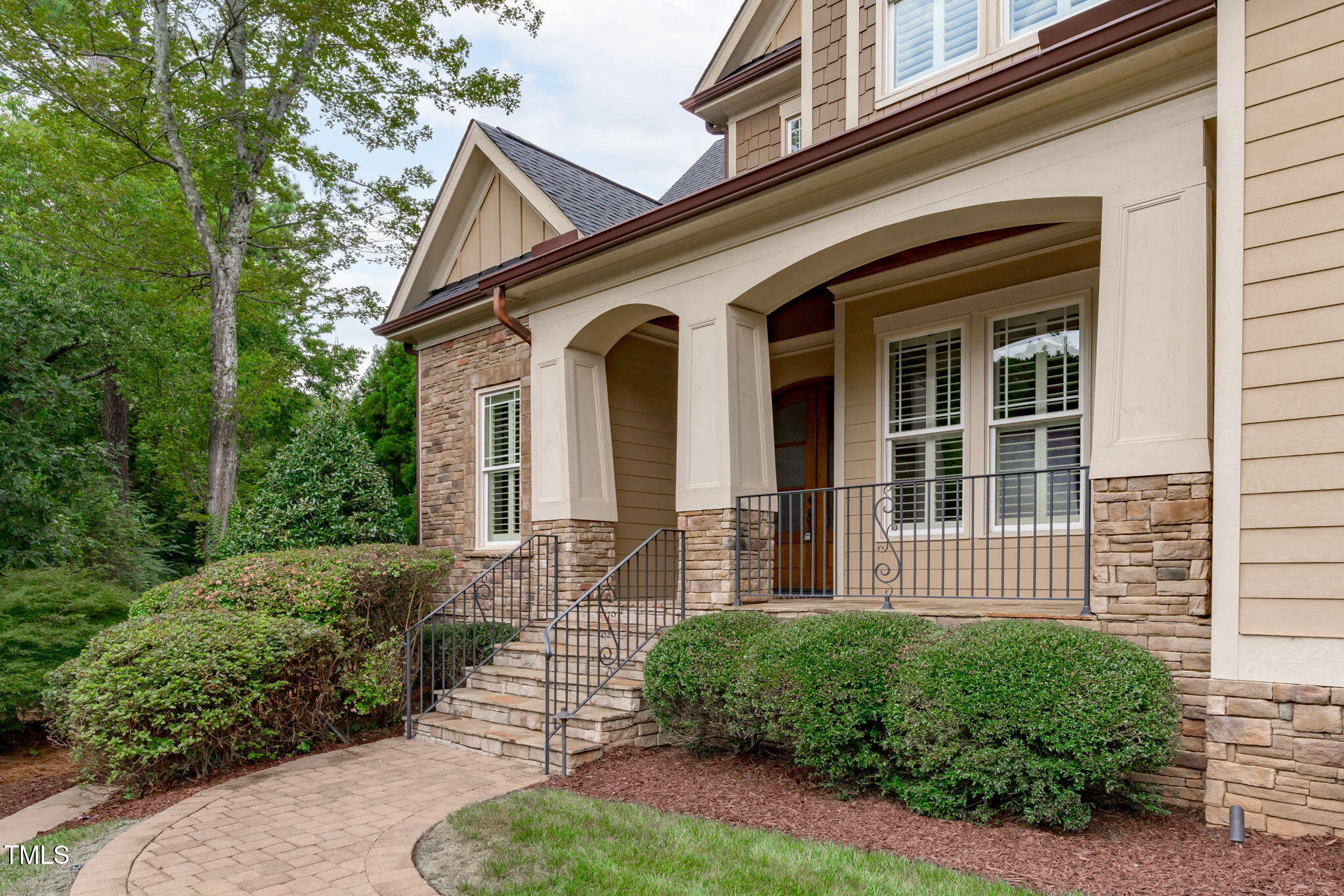 2612 Shadow Hills Court Raleigh, NC 27612 - Photo 4 of 63 a front view of a house with garden