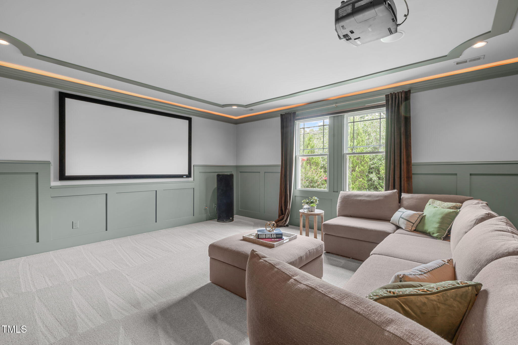 2612 Shadow Hills Court Raleigh, NC 27612 - Photo 53 of 63 a living room with furniture and a flat screen tv