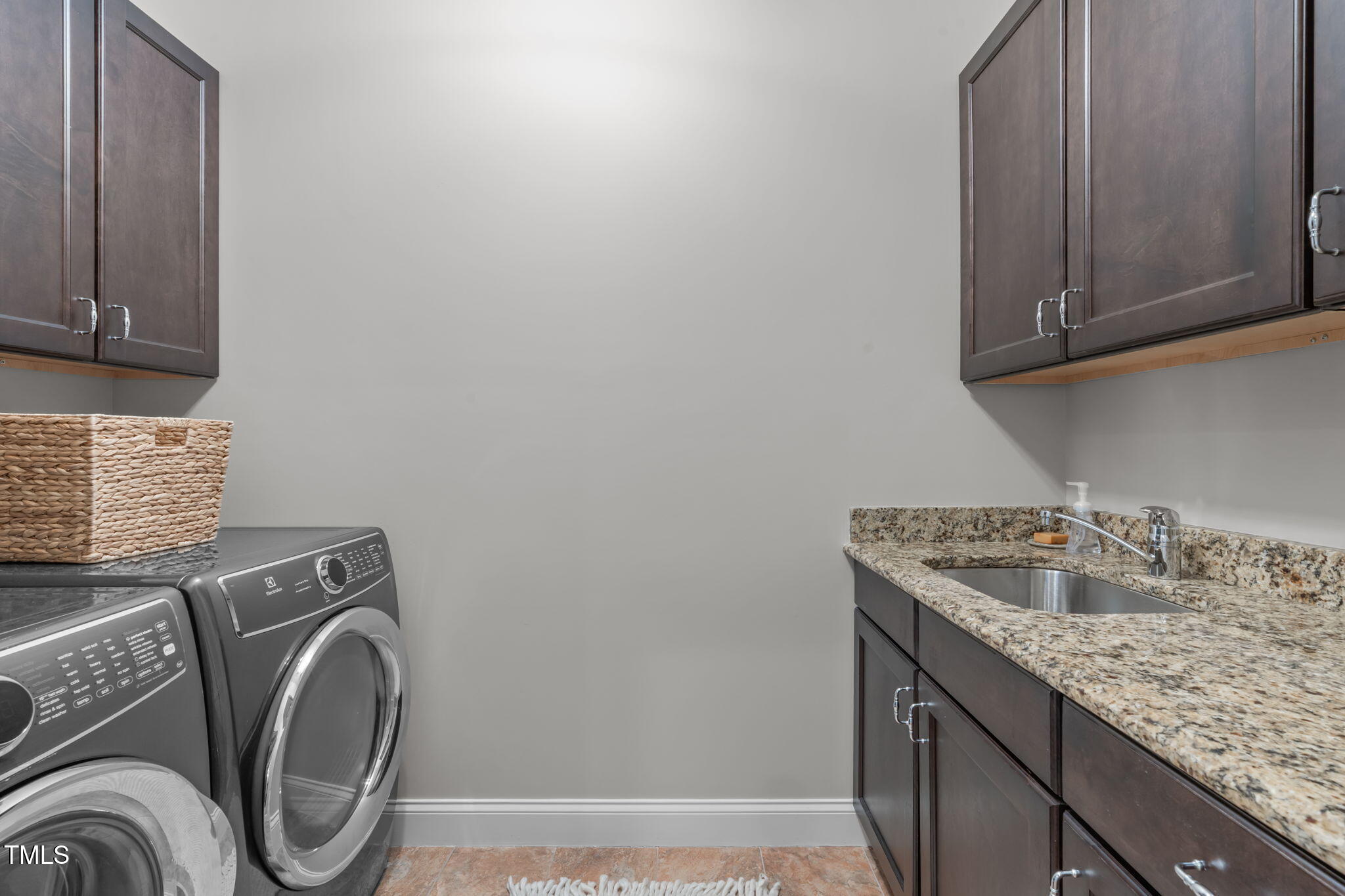 2612 Shadow Hills Court Raleigh, NC 27612 - Photo 56 of 63 a utility room with a sink washer and dryer