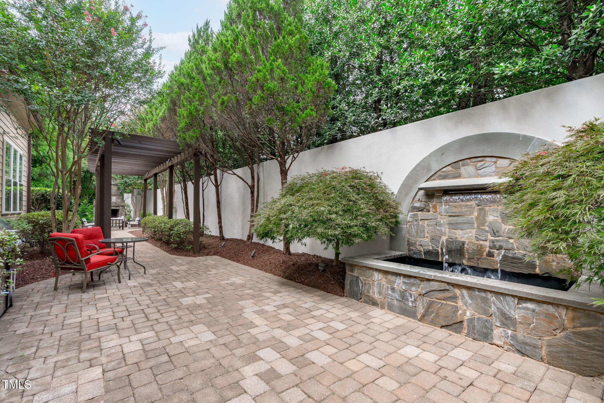 2612 Shadow Hills Court Raleigh, NC 27612 - Photo 57 of 63 a view of a chairs and table in backyard of the house