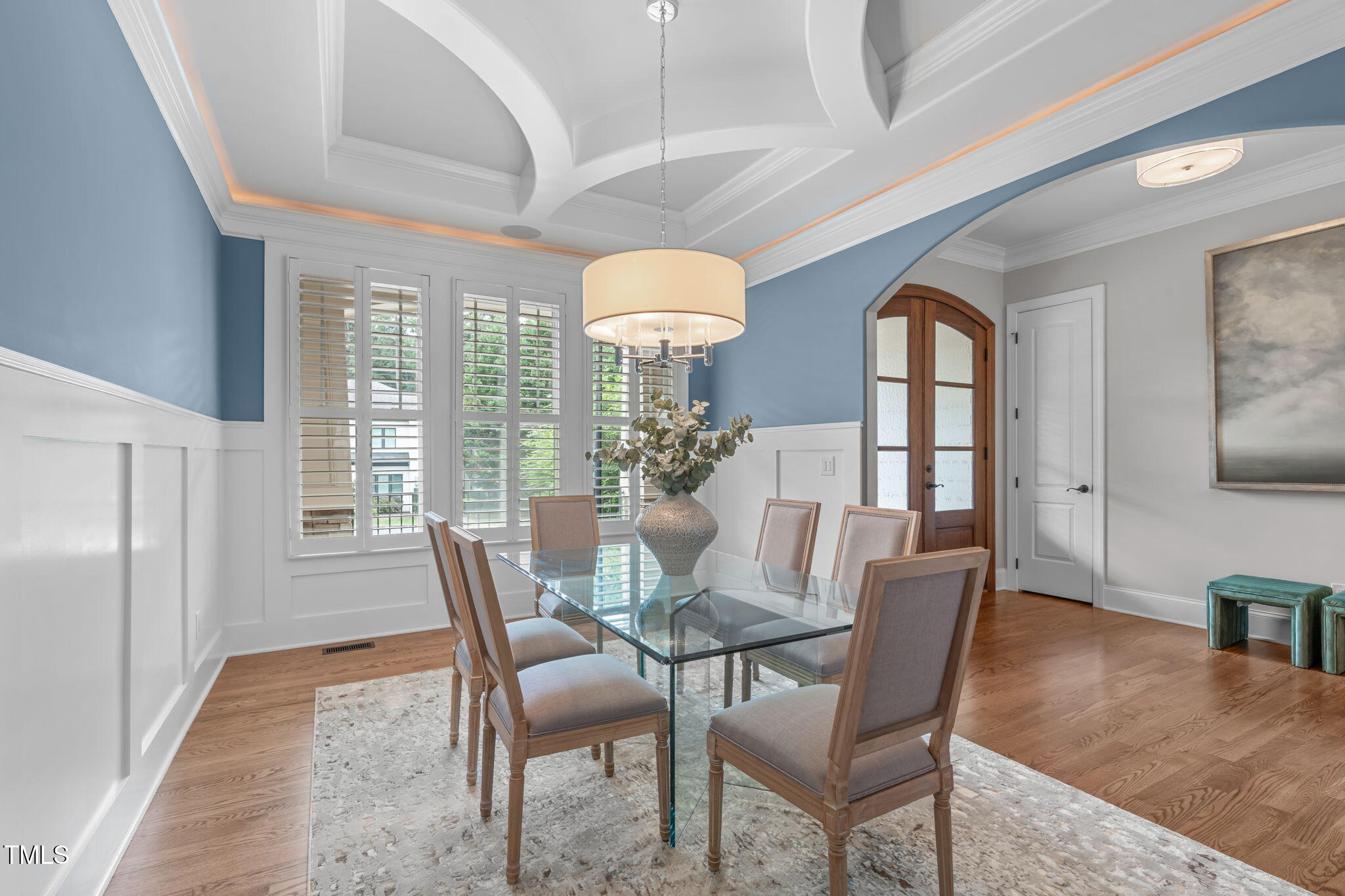 2612 Shadow Hills Court Raleigh, NC 27612 - Photo 9 of 63 a dining room with furniture a chandelier and wooden floor
