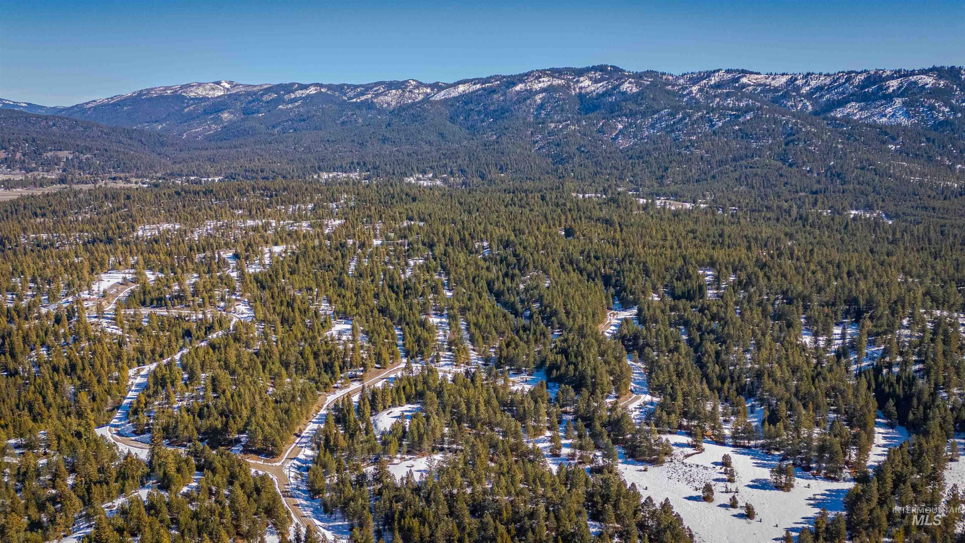 Tbd Skunk Creek Road Cascade, ID 83611 - Photo 11 of 36 Aerial overview of property's location featuring a mountain backdrop