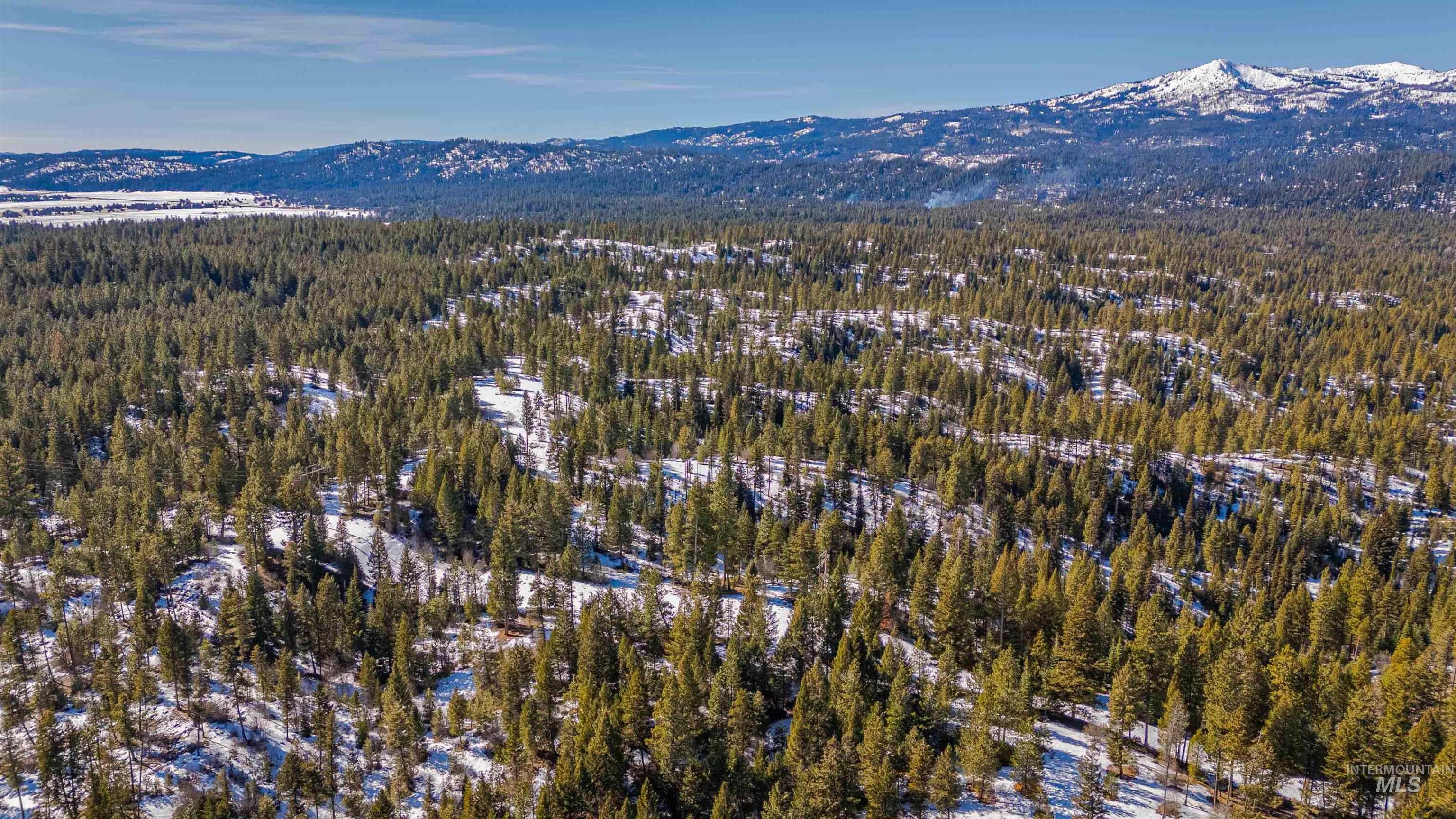 Tbd Skunk Creek Road Cascade, ID 83611 - Photo 26 of 36 Aerial view of property's location with a mountain backdrop