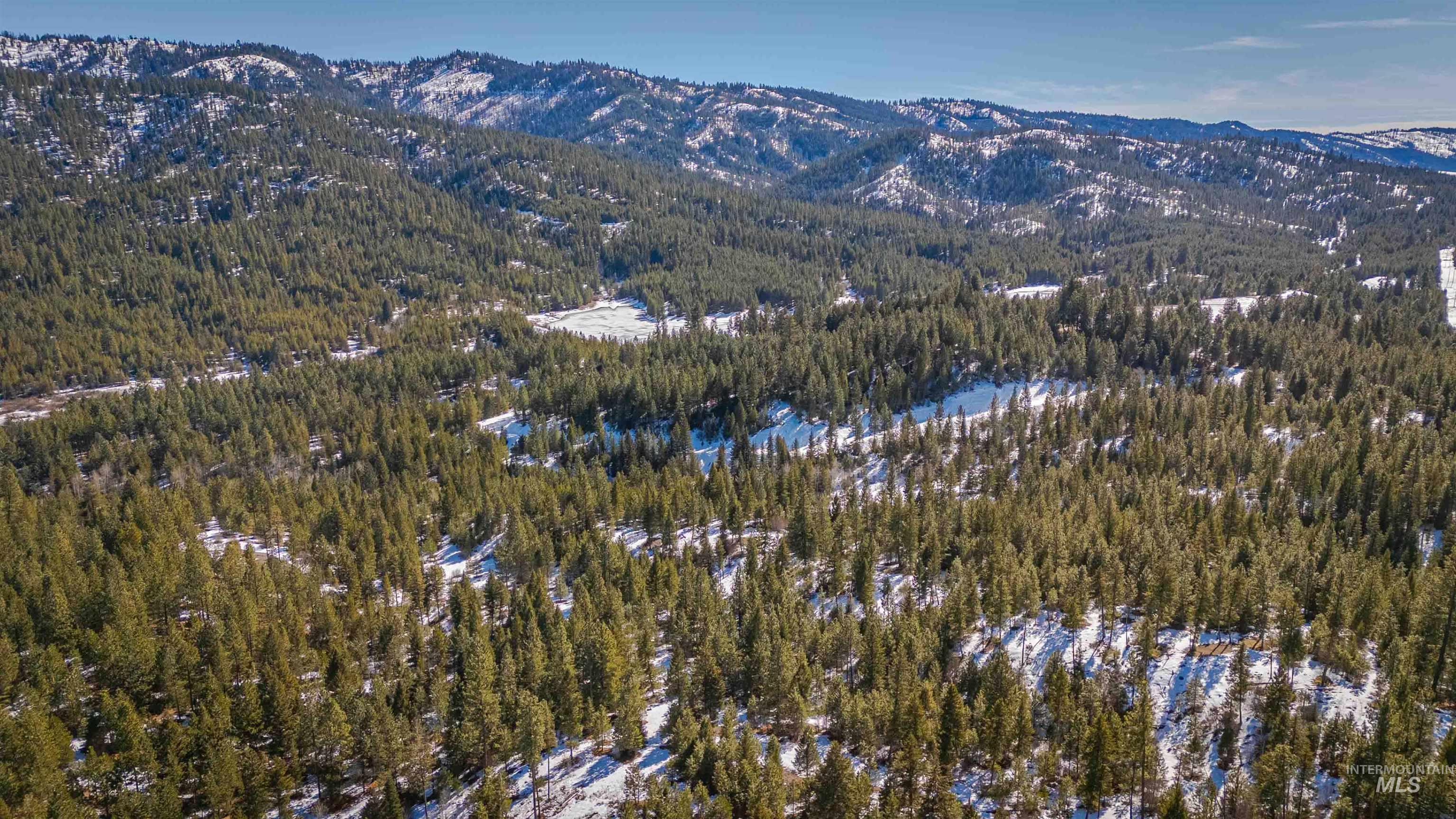 Tbd Skunk Creek Road Cascade, ID 83611 - Photo 29 of 36 Aerial view of property's location with a mountainous background