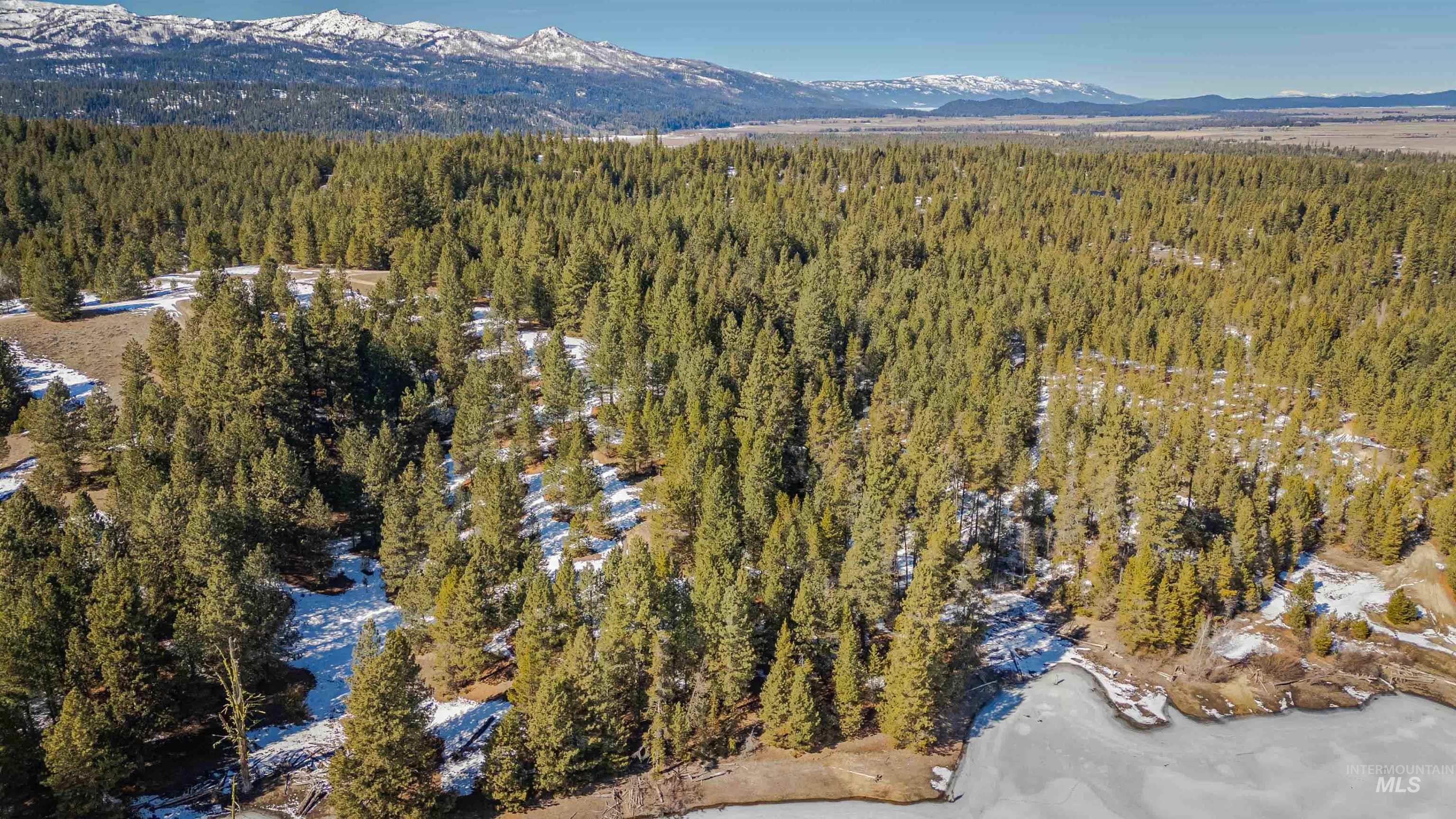 Tbd Skunk Creek Road Cascade, ID 83611 - Photo 31 of 36 Snowy aerial view featuring a mountain view