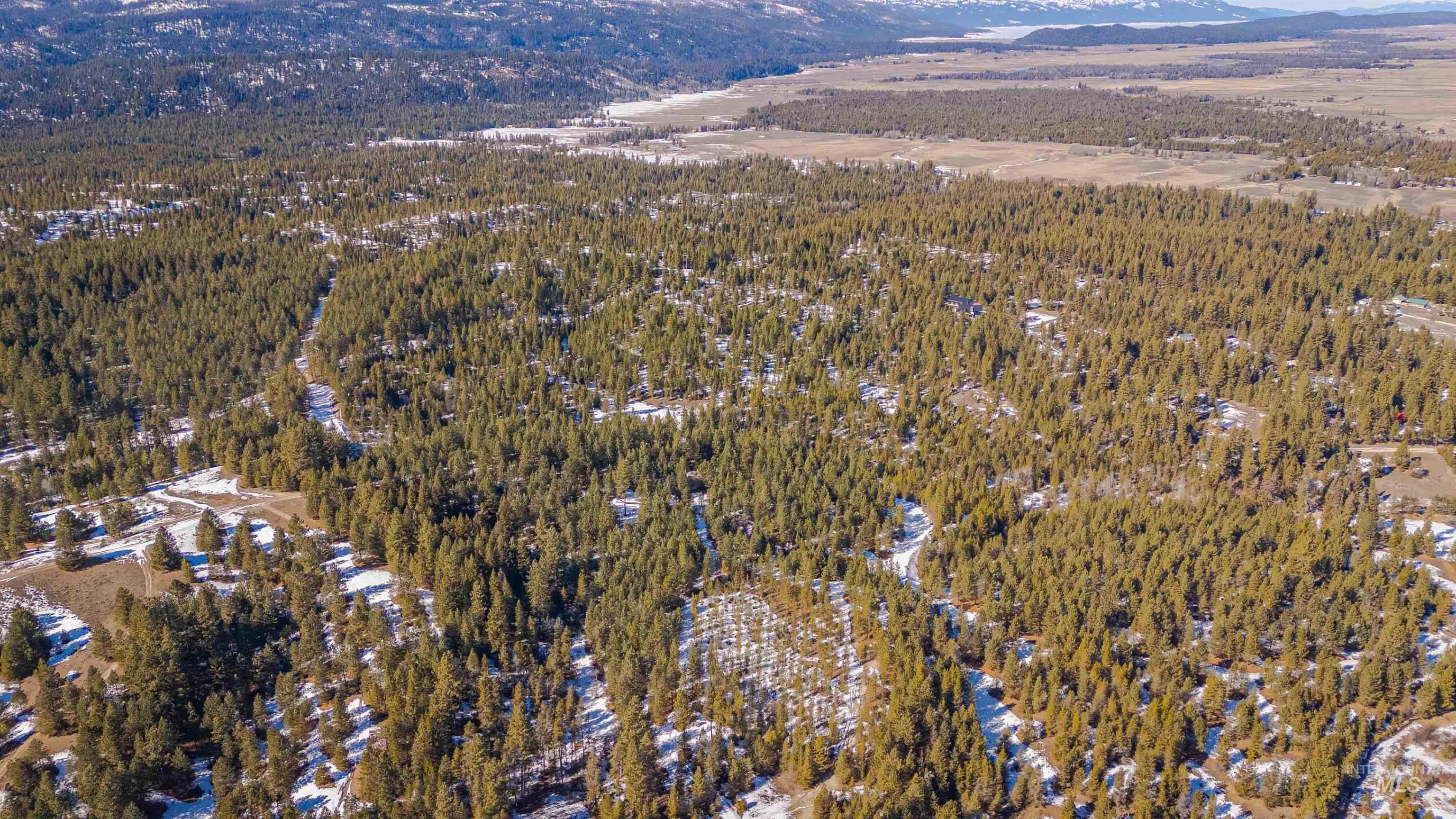 Tbd Skunk Creek Road Cascade, ID 83611 - Photo 33 of 36 Aerial view of property's location featuring a mountain backdrop