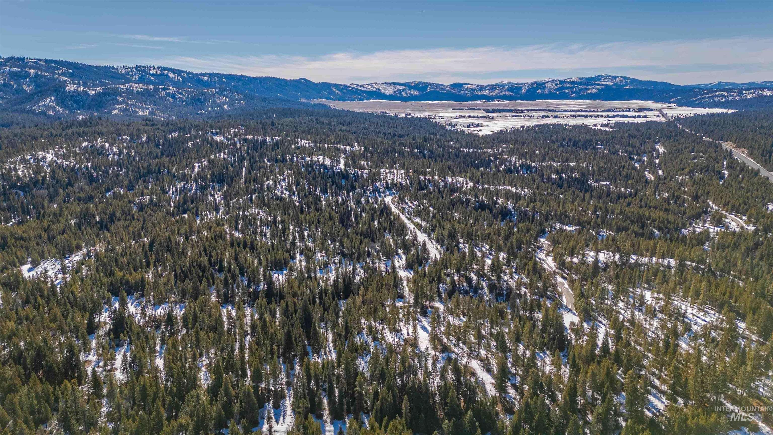 Tbd Skunk Creek Road Cascade, ID 83611 - Photo 5 of 36 Drone / aerial view of a mountainous background and a forest