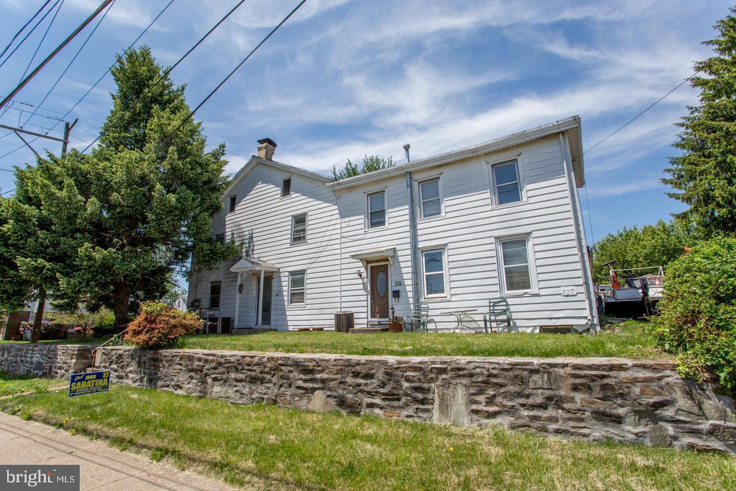 8000 Algon Avenue Philadelphia, PA 19152 - Photo 3 of 15 Charming two-story home with lush greenery.
