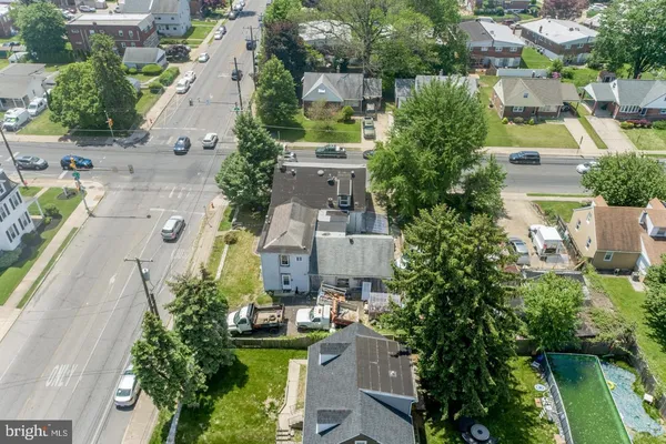 an aerial view of a house with outdoor space