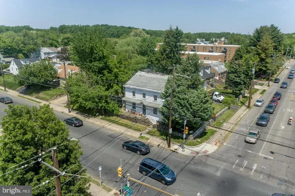 an aerial view of a house with a yard and a garage