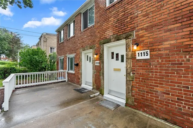 a view of a brick wall of the building