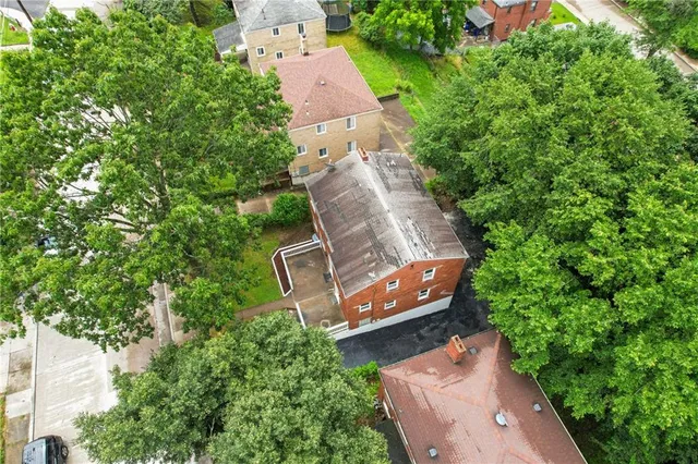 an aerial view of a house with outdoor space