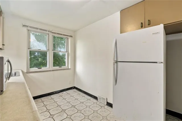 a view of a storage & utility room with a sink