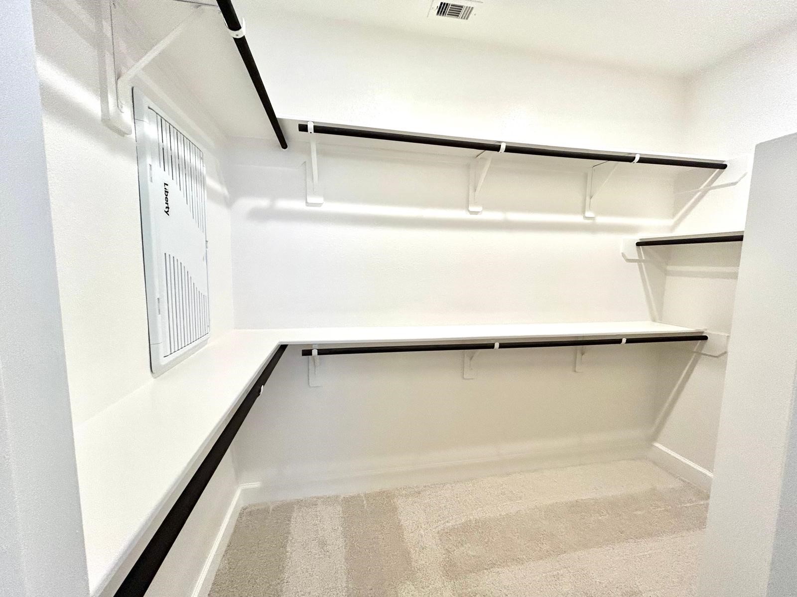 211 Sierra Strm Lane Conroe, TX 77304 - Photo 13 of 25 a view of walk in closet with empty racks