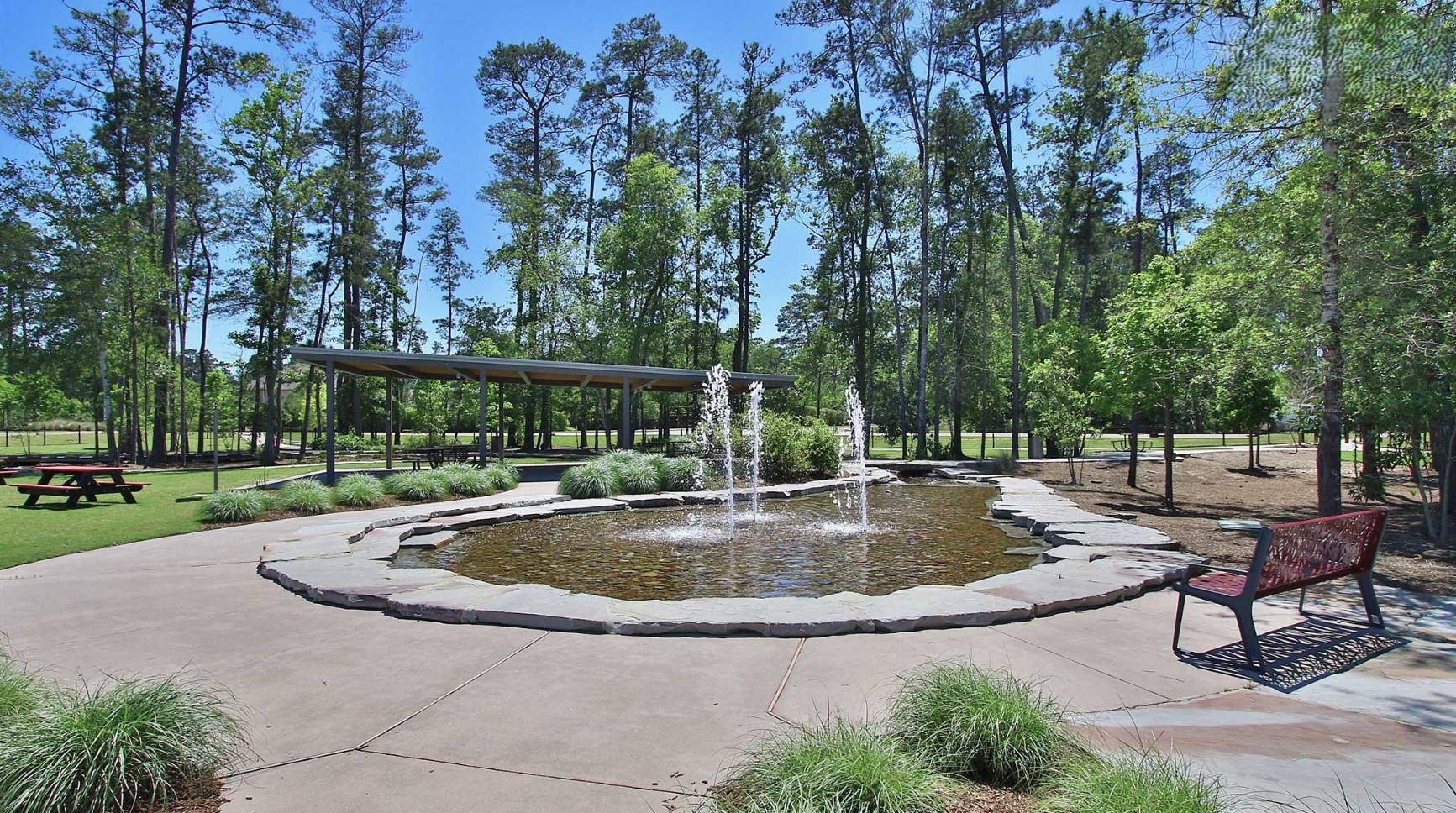 211 Sierra Strm Lane Conroe, TX 77304 - Photo 19 of 25 a view of a swimming pool with a patio
