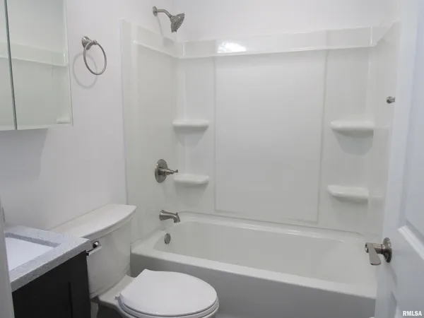 a bathroom with a bathtub a toilet and a shower