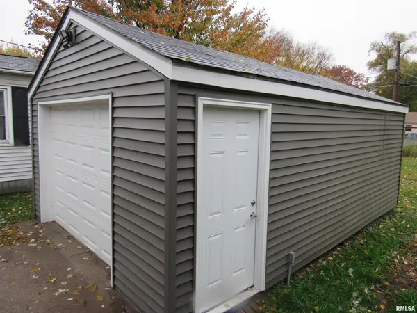 a house with a yard and garage