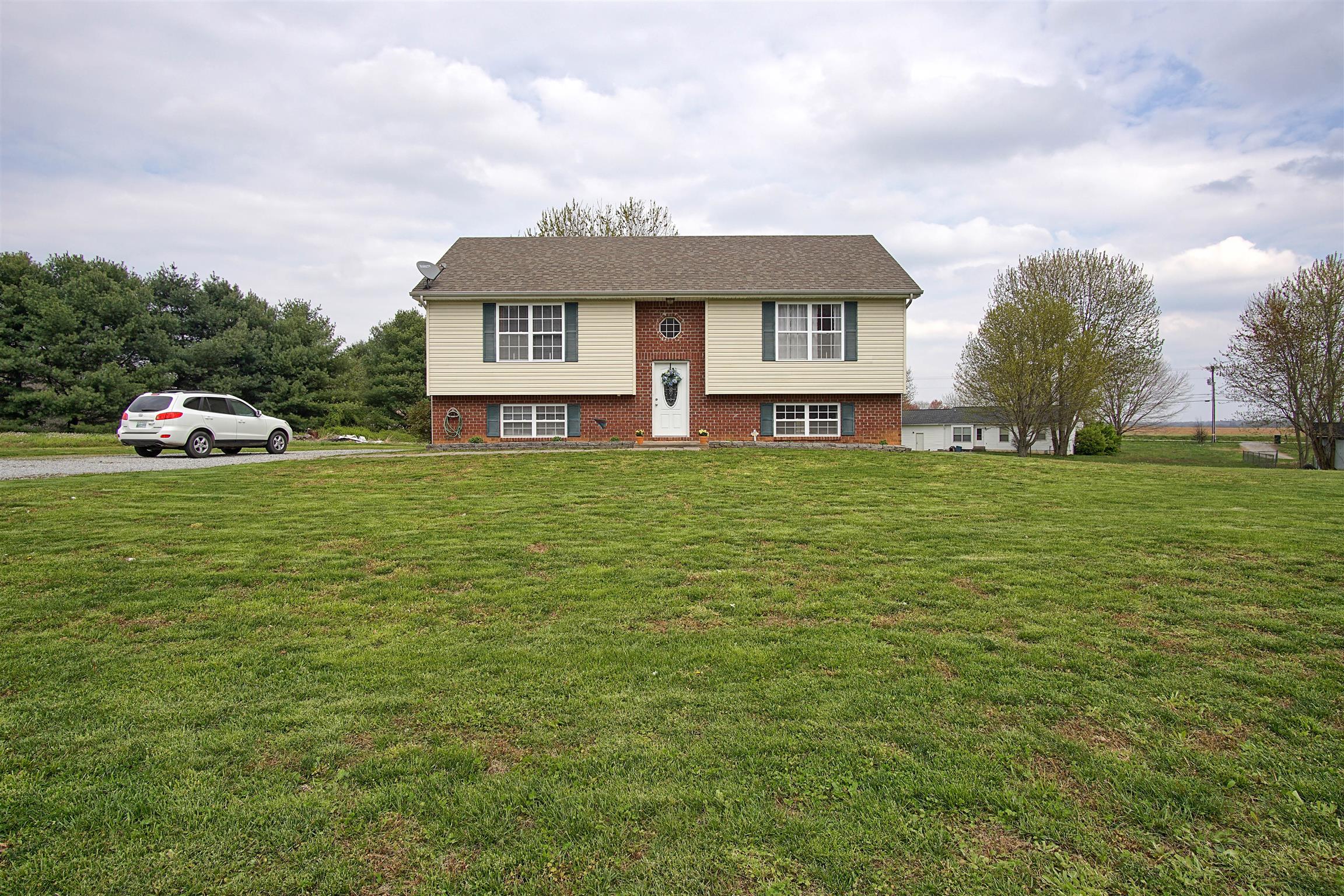 5194 William Woodard Road Springfield, TN 37172 - Photo 1 of 23 a view of a house with a big yard and large trees